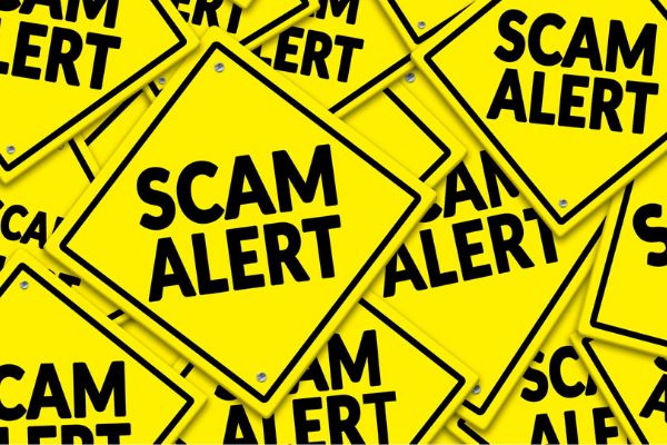 Yellow scam alert sign